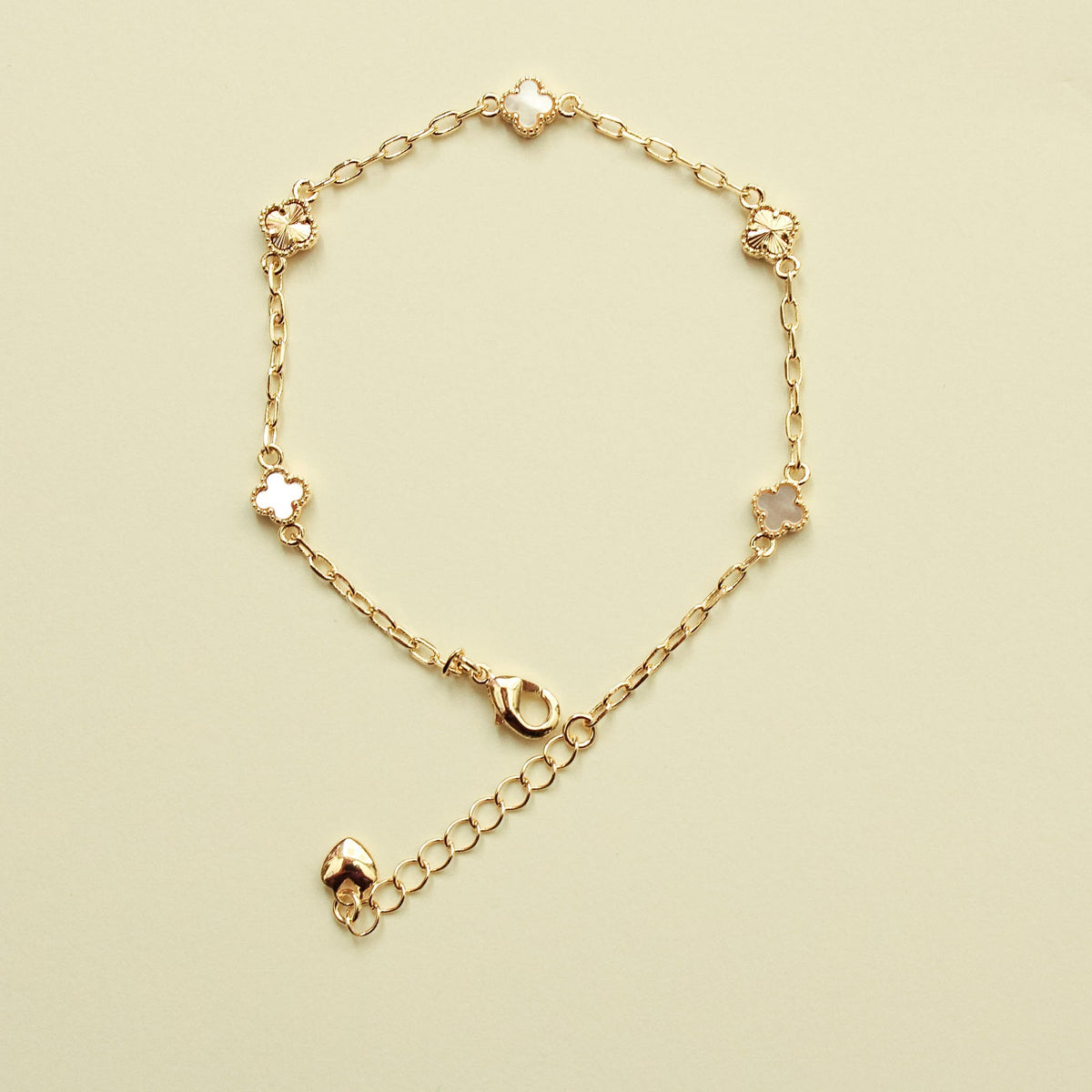 Gold-tone clover bracelet with mother-of-pearl inlay and toggle clasp