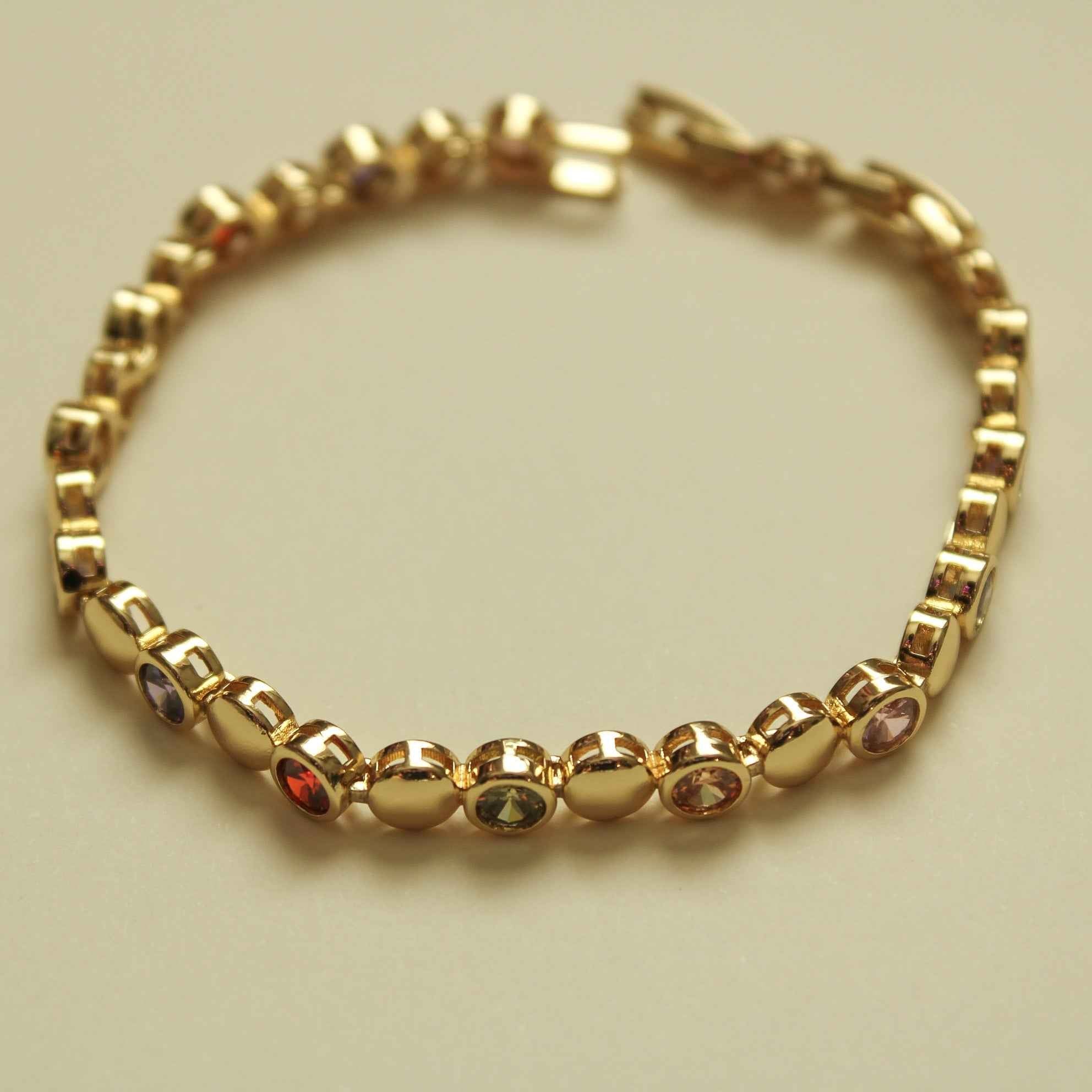Gold tennis bracelet with multicolor CZ round stones in bezel settings, link chain