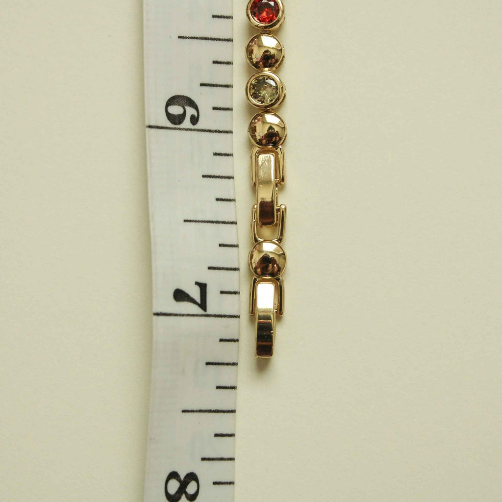 Gold bracelet clasp segment with multicolor CZ stones and curb-link bar details