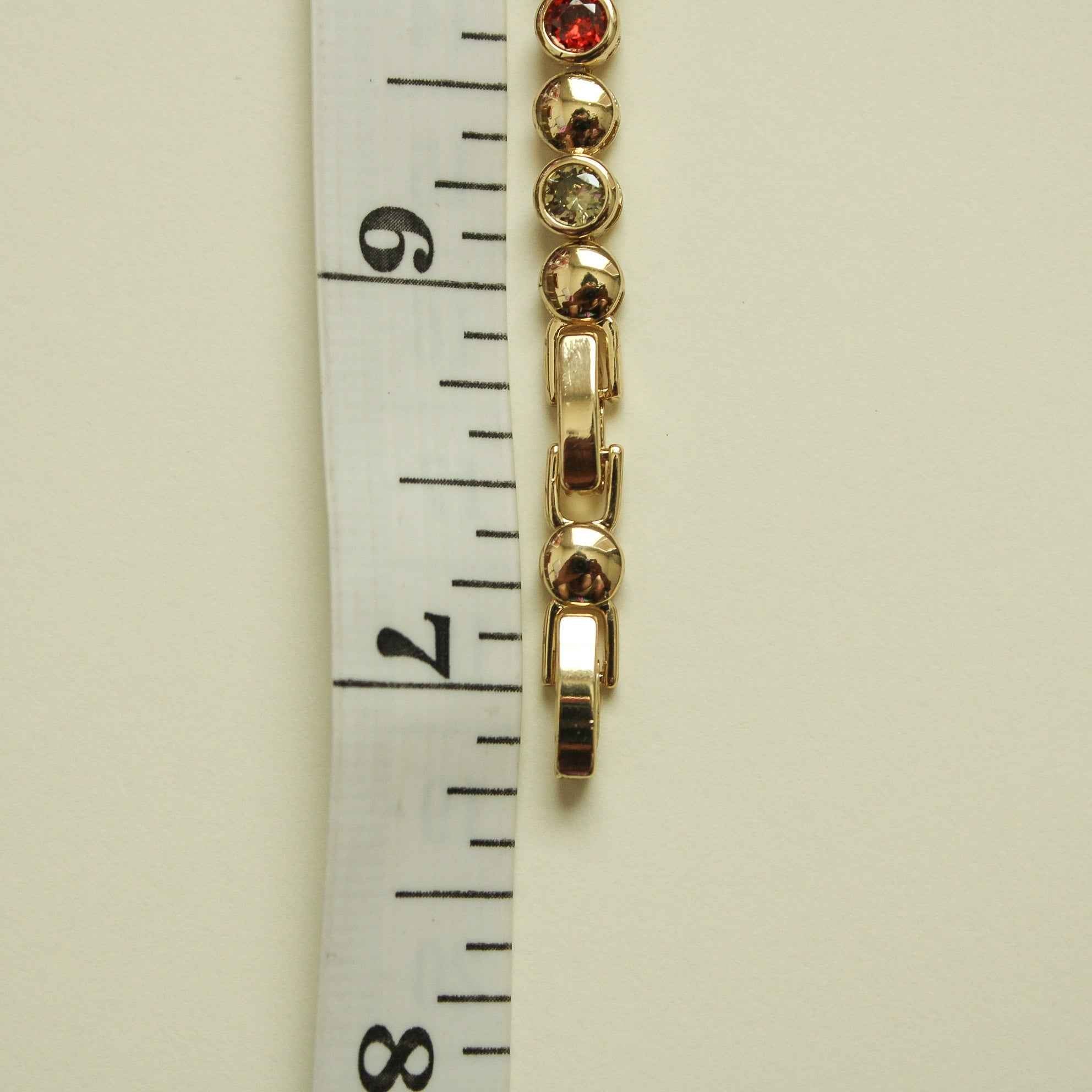 Gold bracelet clasp segment with multicolor CZ stones and curb-link bar details