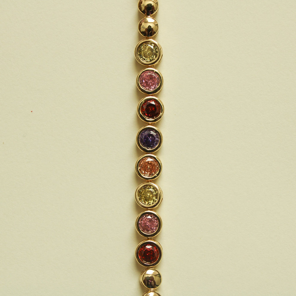 Gold tennis bracelet with round multicolor CZ bezel stones