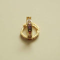 Gold-tone huggie hoop earrings with multicolor CZ stones, single hoop view