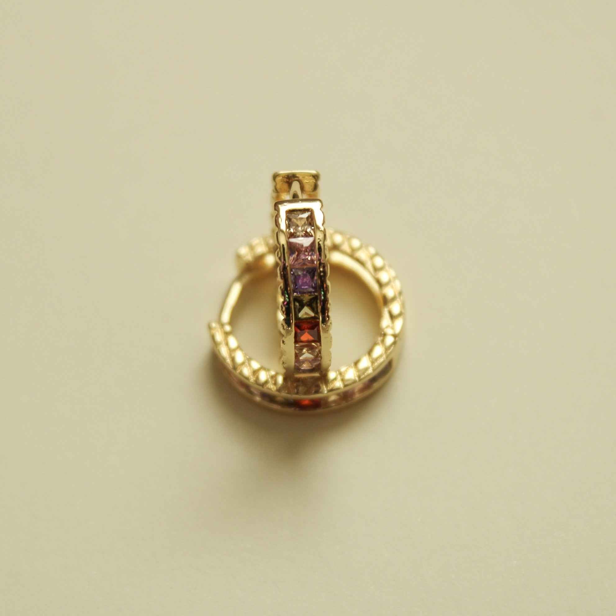 Gold-tone huggie hoop earrings with multicolor CZ stones, single hoop view