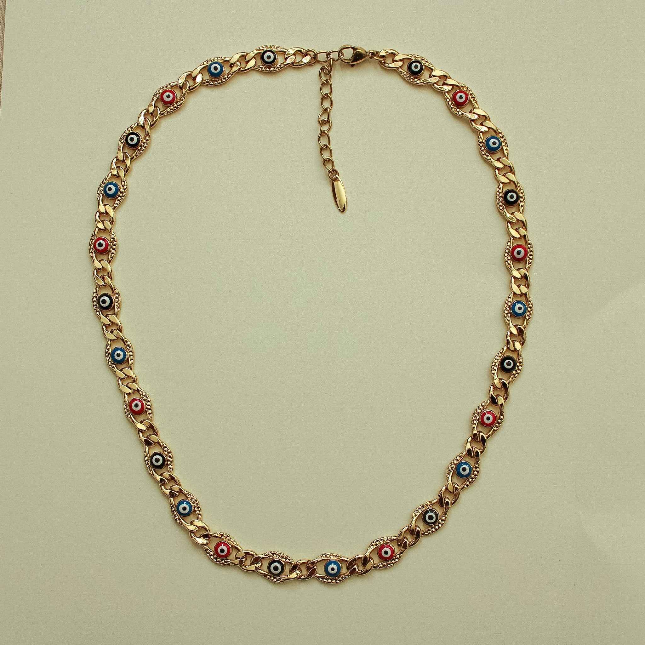 Gold-tone evil eye charm necklace with round eye insets around the full length