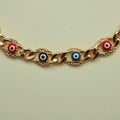 Gold-tone Cuban link necklace with multicolor evil eye charms along the chain