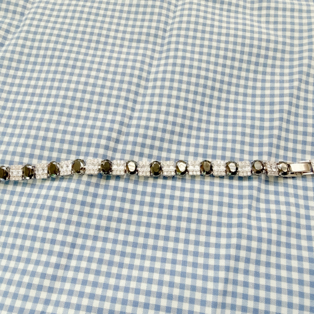 Tennis bracelet side view with black stones and clear square CZ rows