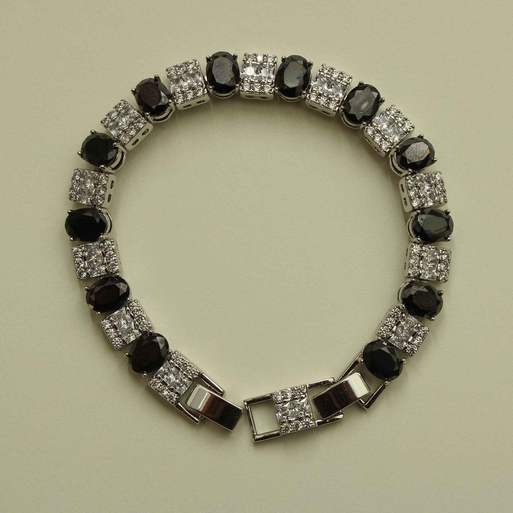 Silver tennis bracelet with black round stones and clear square CZ accents