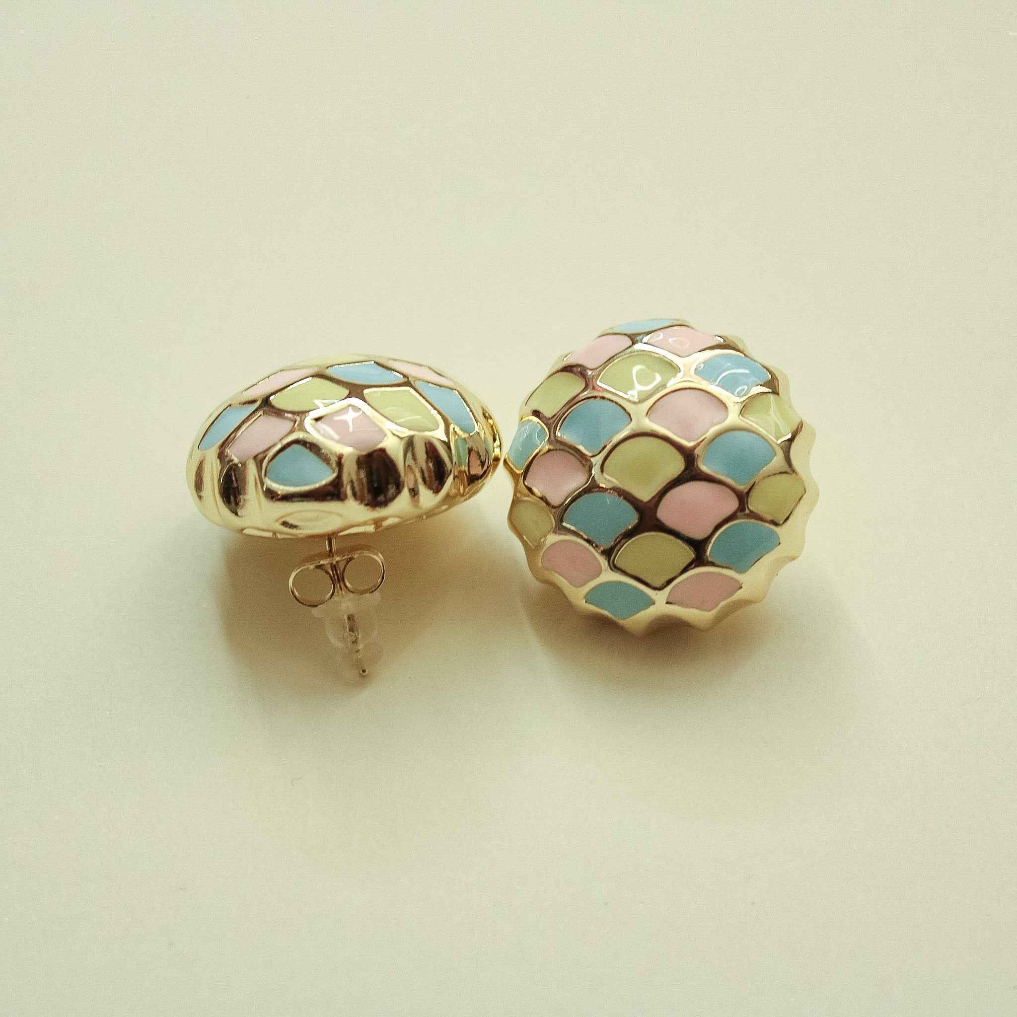 Dome stud earrings with pastel scale enamel, gold-tone backs and posts visible