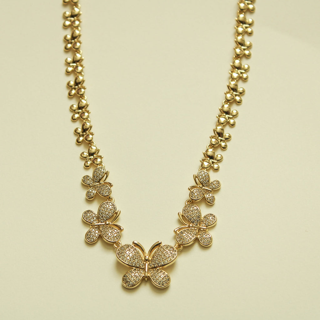 Gold pavé butterfly necklace with three charms and ball-bead chain