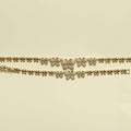 Gold butterfly bracelet with pavé butterfly charms on a double chain band