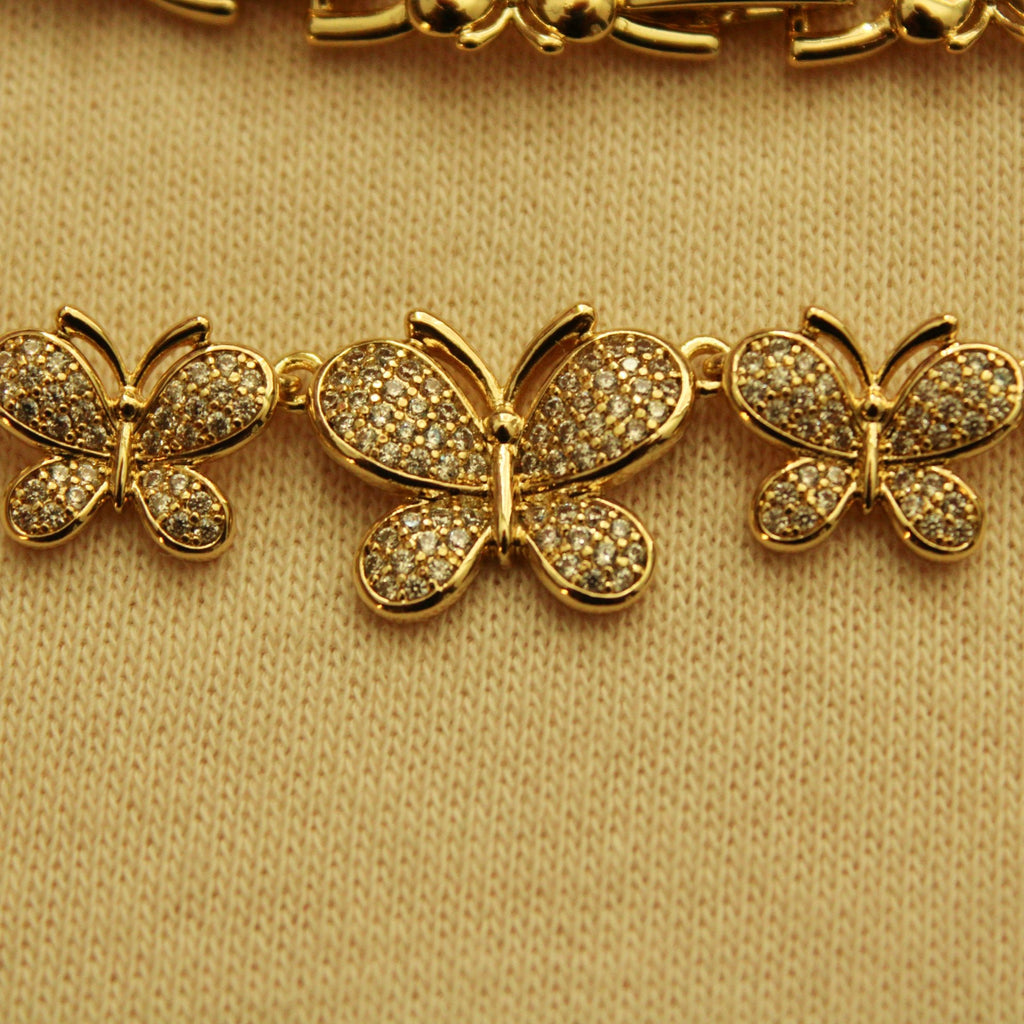 Gold pavé butterfly bracelet charms with three butterfly motifs