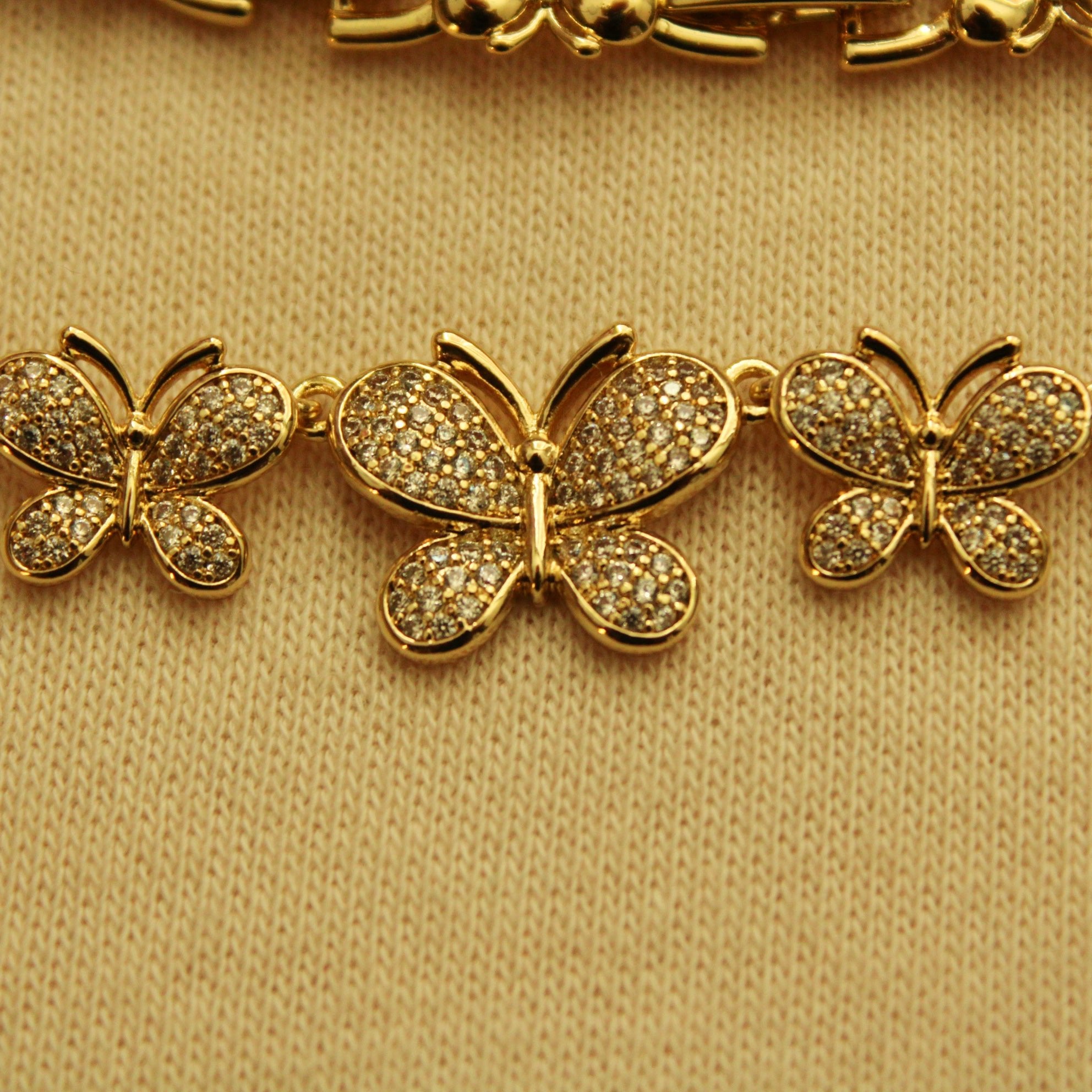 Gold pavé butterfly bracelet charms with three butterfly motifs