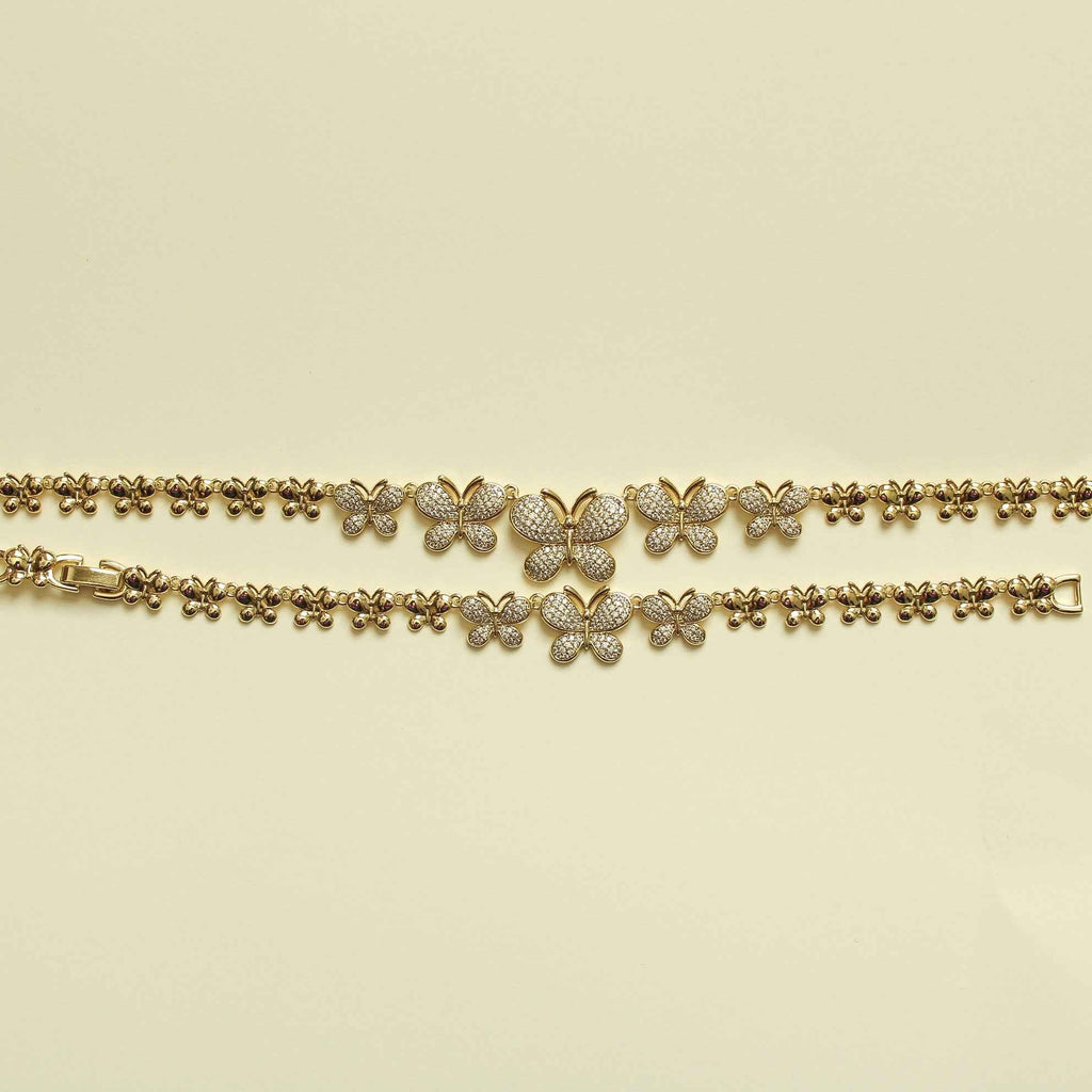 Gold butterfly bracelet with small pavé butterfly charms along chain links