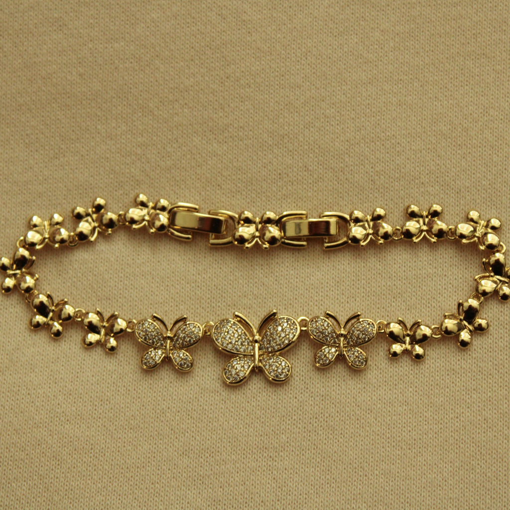 Gold butterfly bracelet with toggle clasp and pavé bead-and-chain links