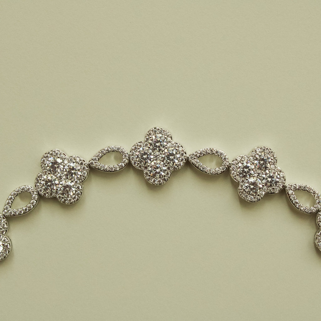 Close-up of CZ clover flower bracelet with sparkling round clover center stones