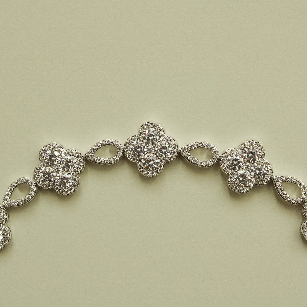 Close-up of CZ clover flower bracelet with sparkling round clover center stones
