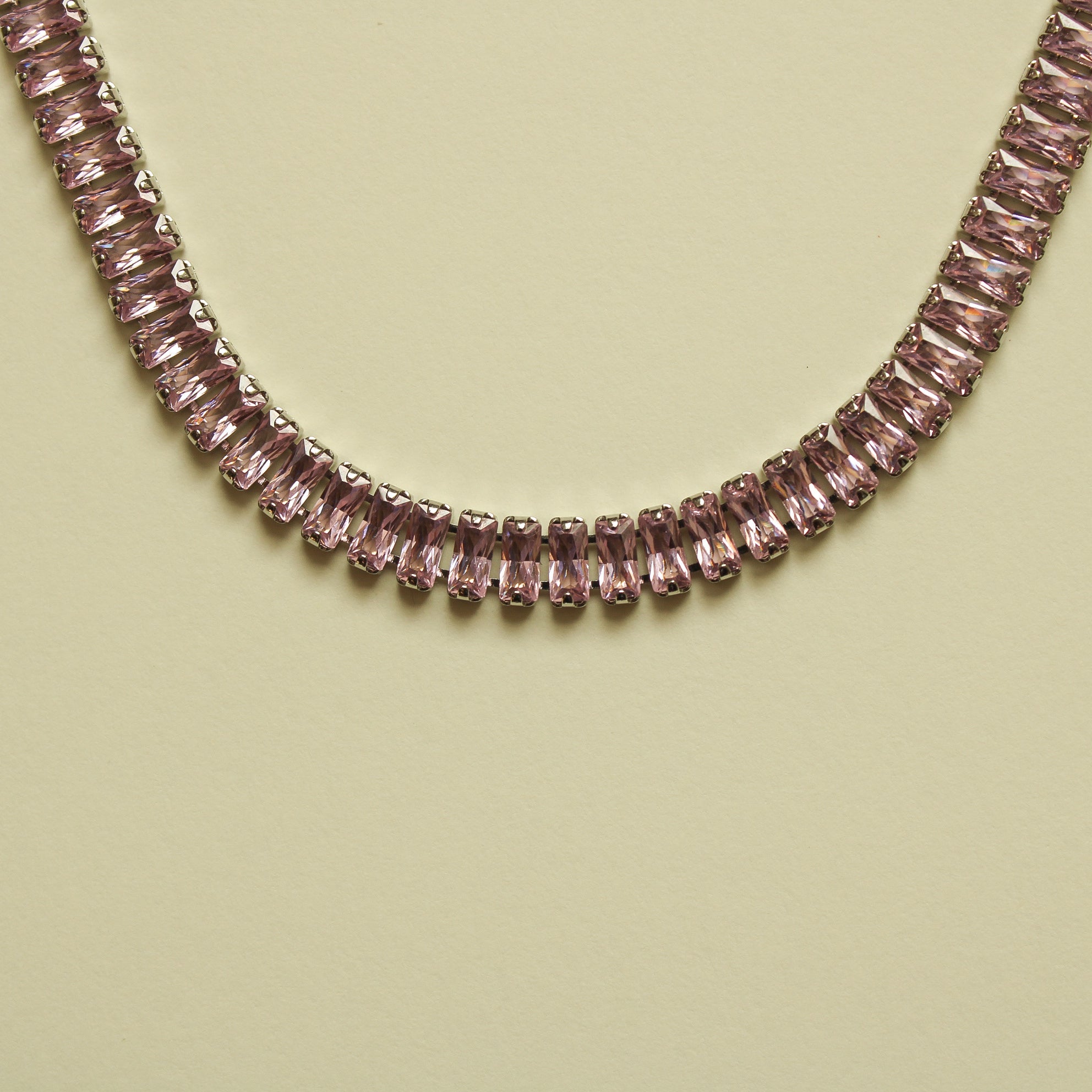 Pink baguette tennis necklace strand with evenly set faceted stones