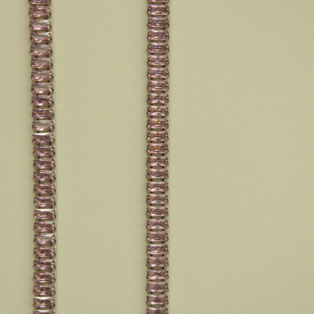 Pink baguette tennis necklace, vertical close-up of faceted stone links