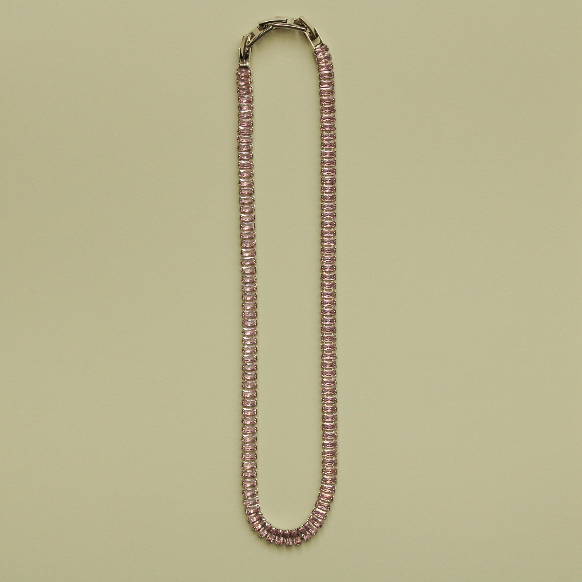 Pink baguette tennis necklace with faceted stones and box clasp, full length