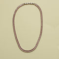 Pink baguette tennis necklace with box-style clasp, oval chain