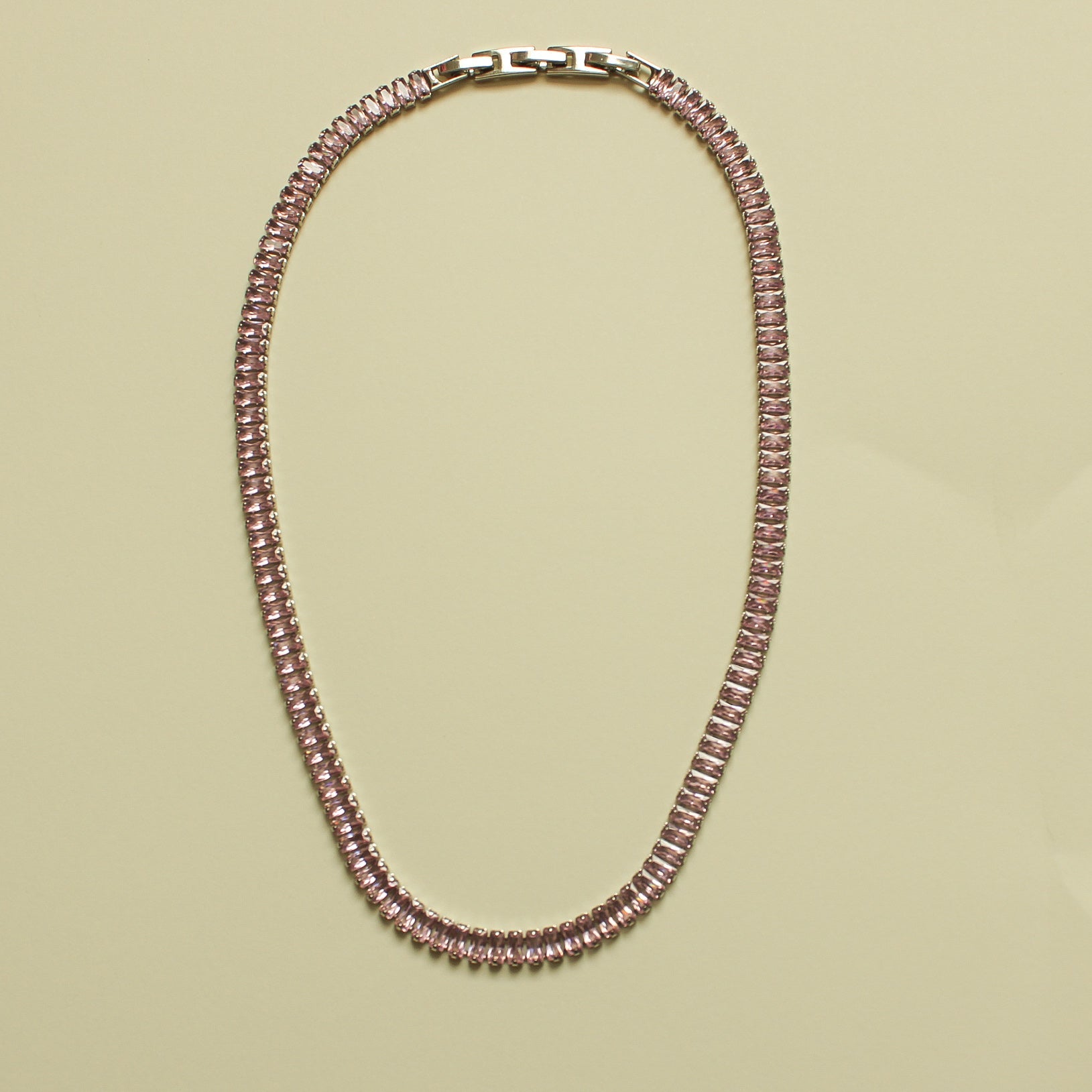 Pink baguette tennis necklace with box-style clasp, oval chain