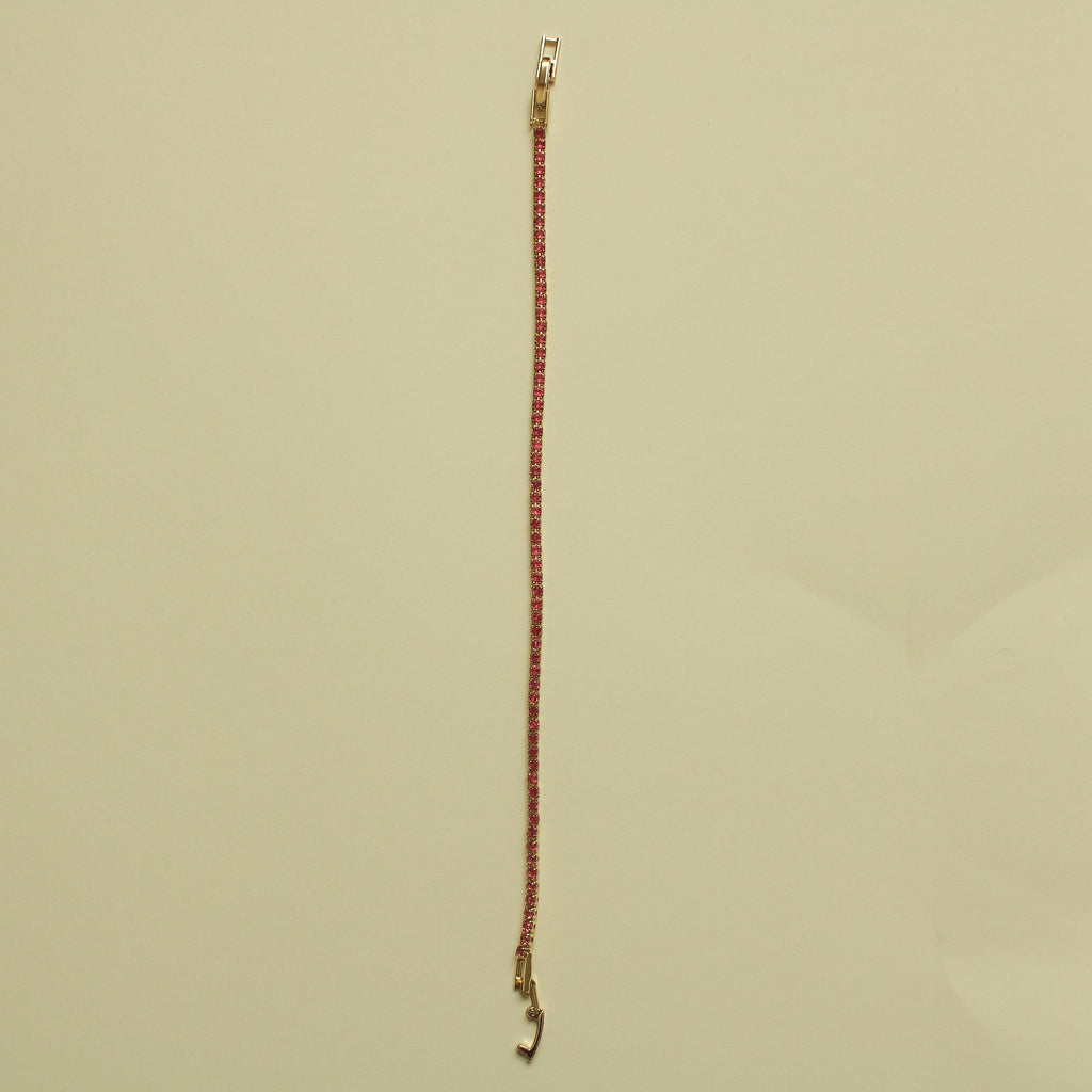 Gold-tone tennis bracelet with pink CZ row and open hook clasp at one end.