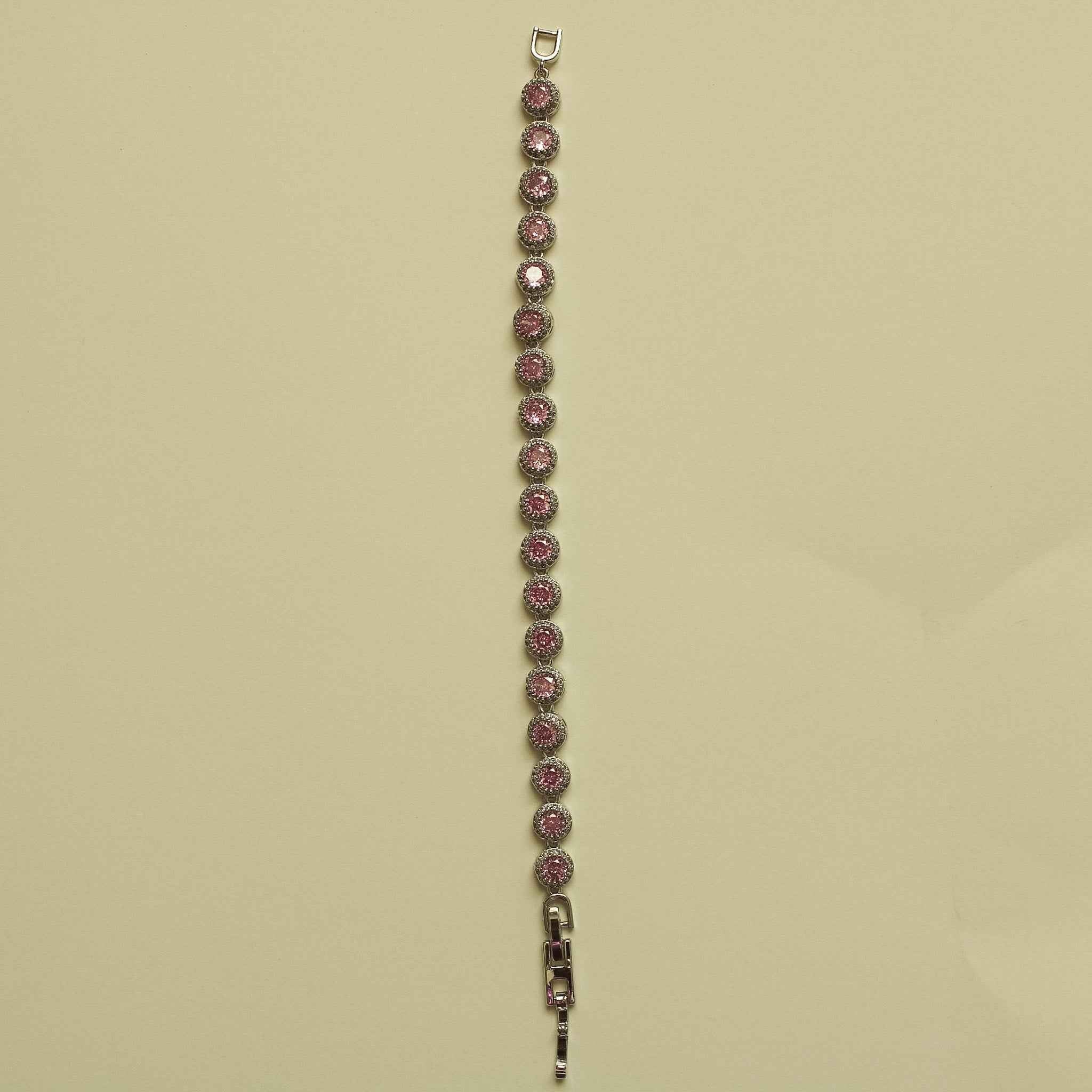 Pink halo CZ tennis bracelet with small loop clasp and row of round stones