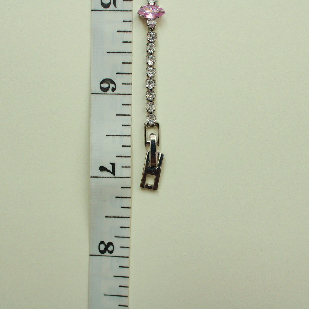 Pink marquise and clear CZ tennis bracelet shown with box clasp, side view