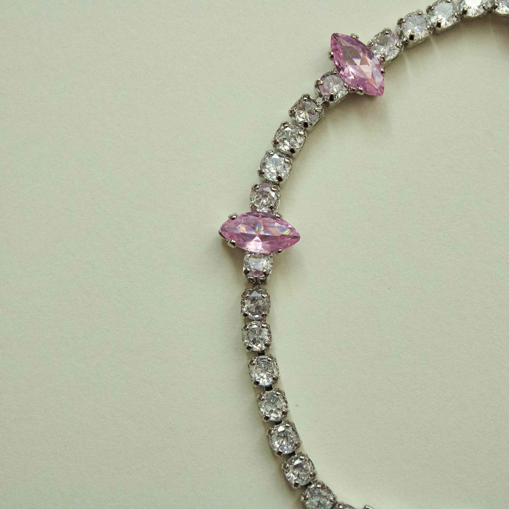 CZ tennis bracelet with marquise pink stones and small clear stones, curved layout