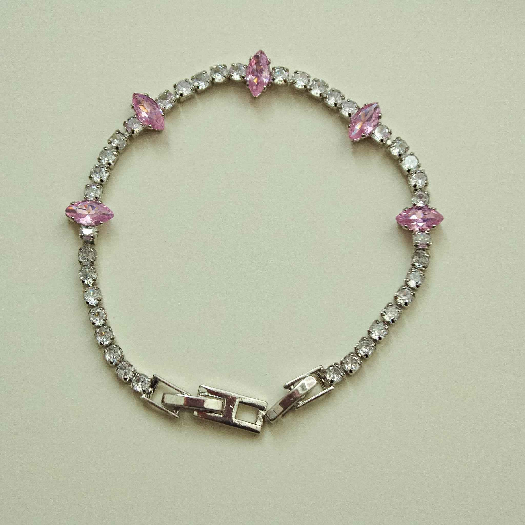 Pink marquise CZ tennis bracelet with round clear stones and hinged clasp