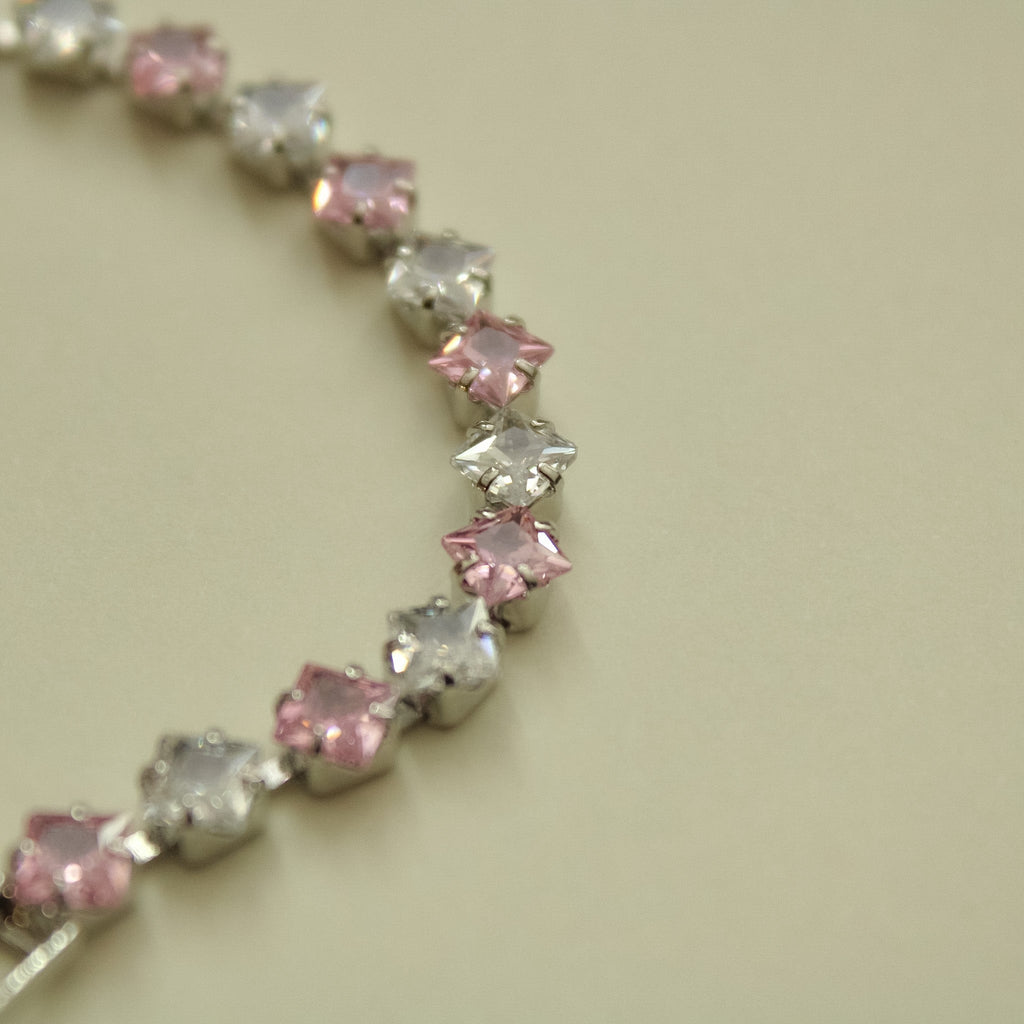 Princess-cut CZ tennis bracelet closeup with pink and clear stones