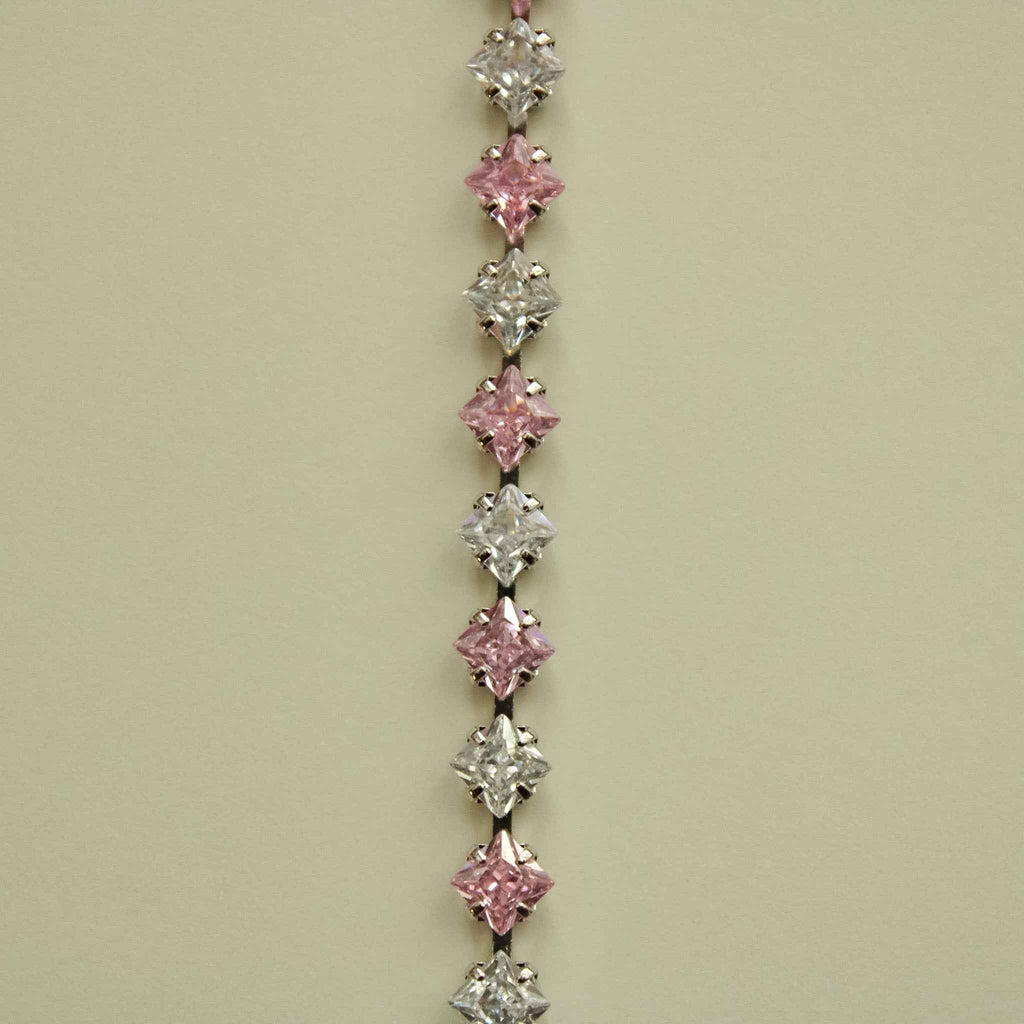 Tennis bracelet featuring alternating pink and clear princess-cut CZ stones