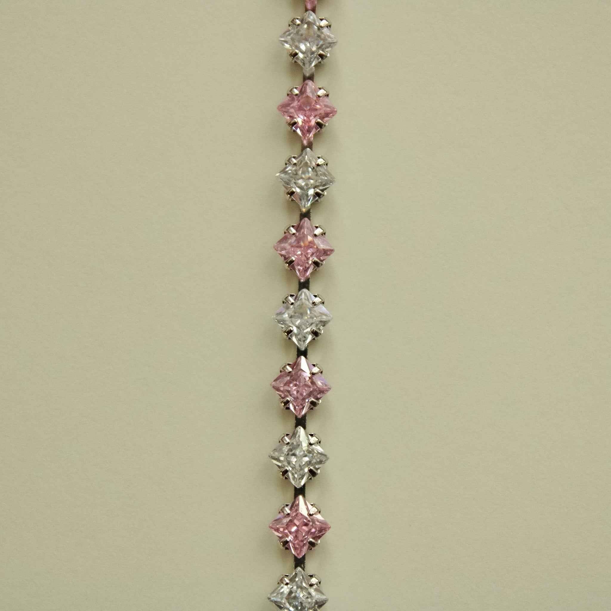 Tennis bracelet featuring alternating pink and clear princess-cut CZ stones