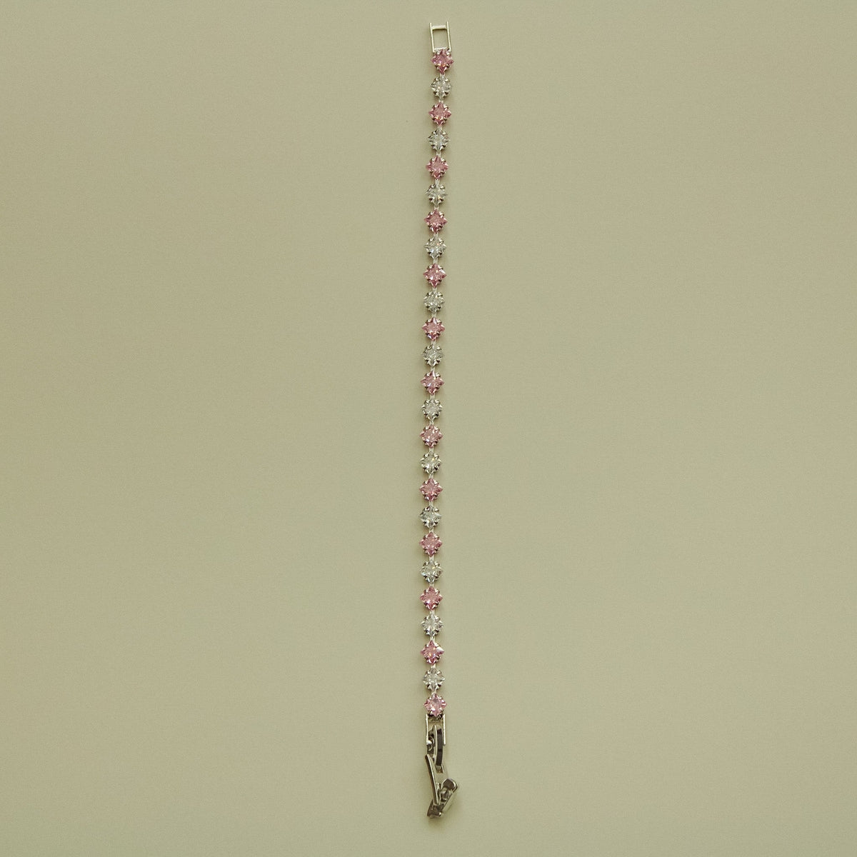 Tennis bracelet with pink and clear princess-cut CZ stones in a row