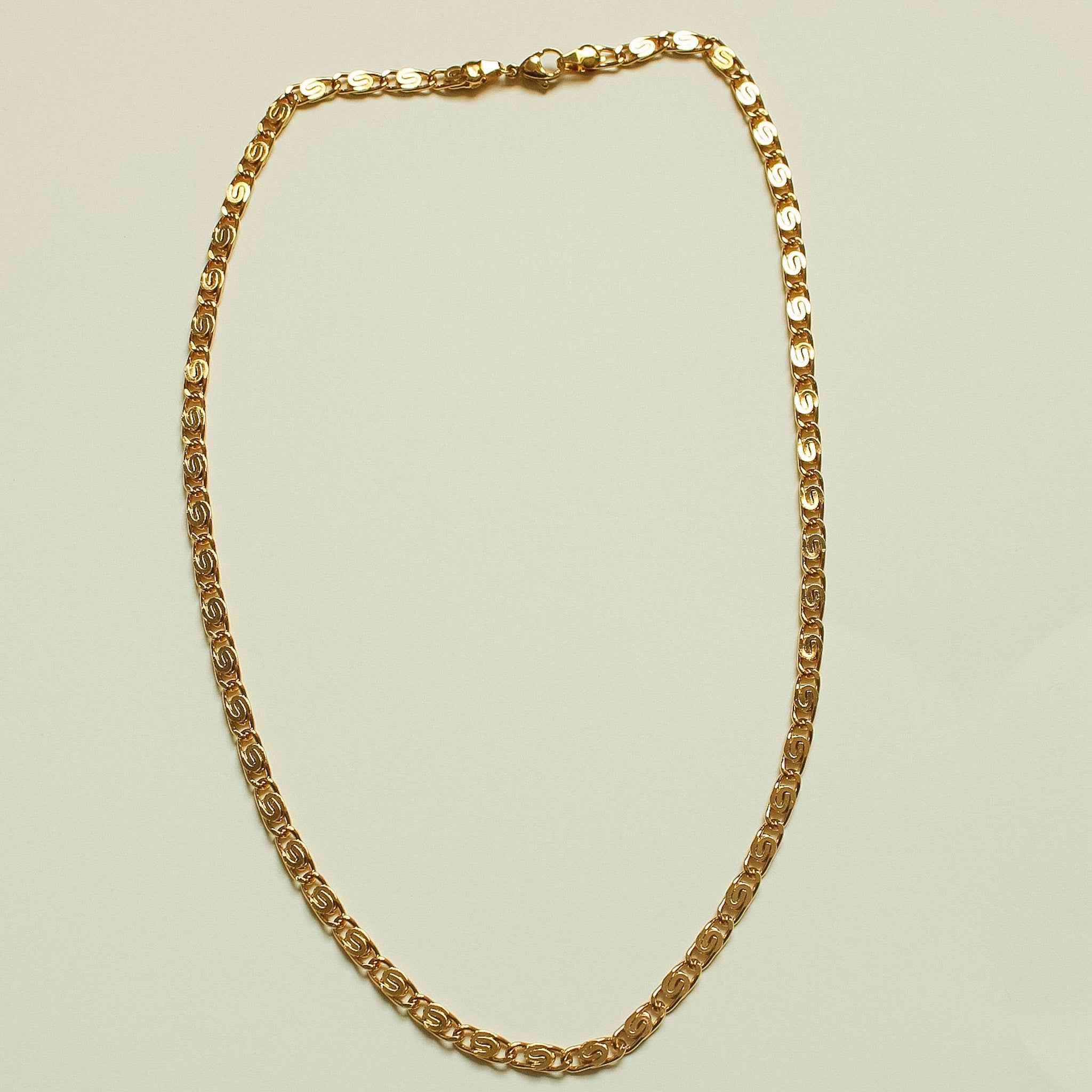 Gold S-link chain necklace, full oval-link collar shape