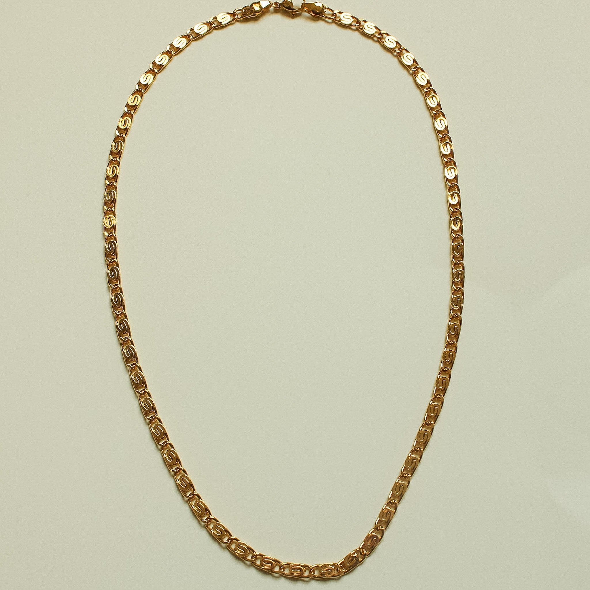 Gold S-link chain necklace, oval links and curved chain design