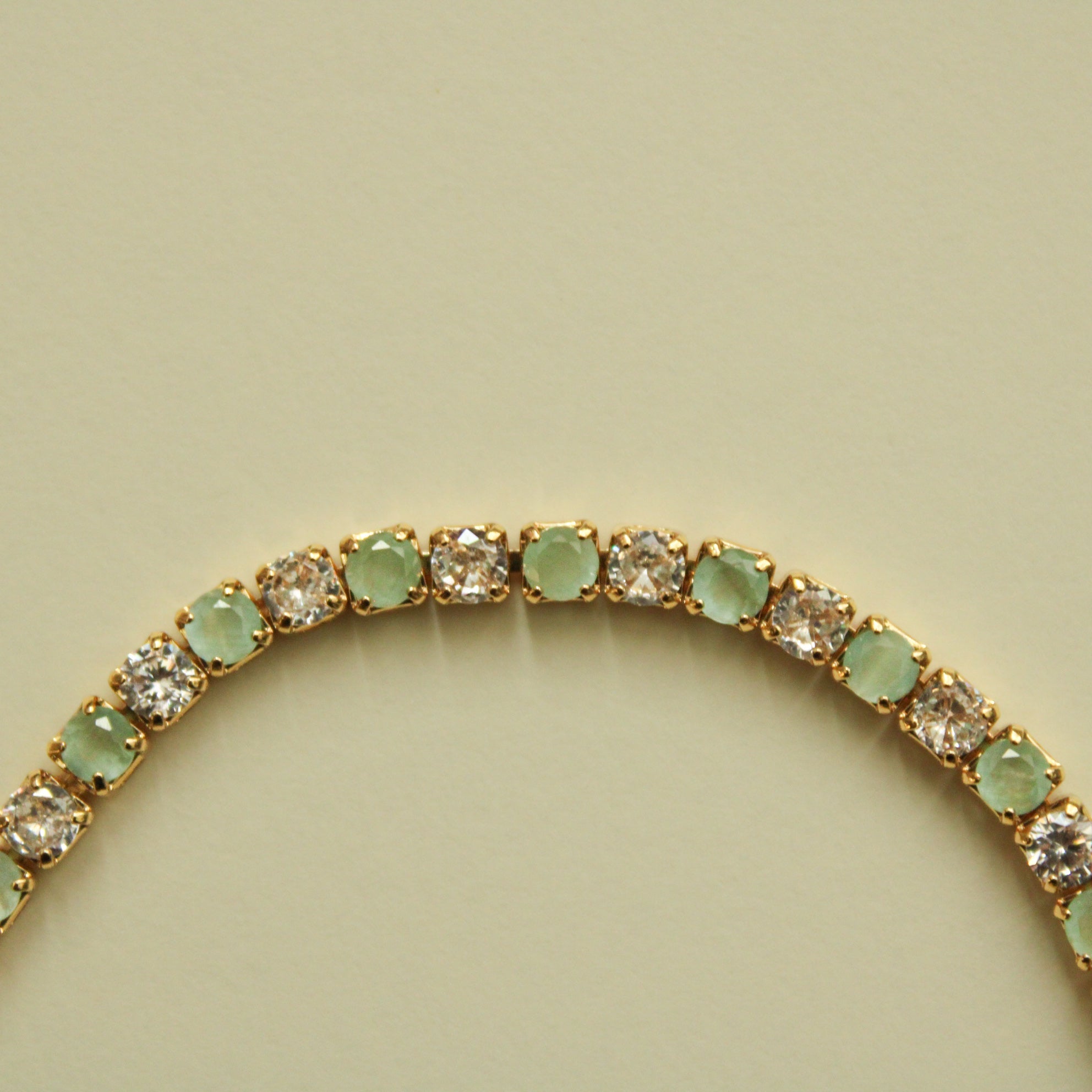 Seafoam green and clear CZ tennis bracelet, close-up of round stones on the band