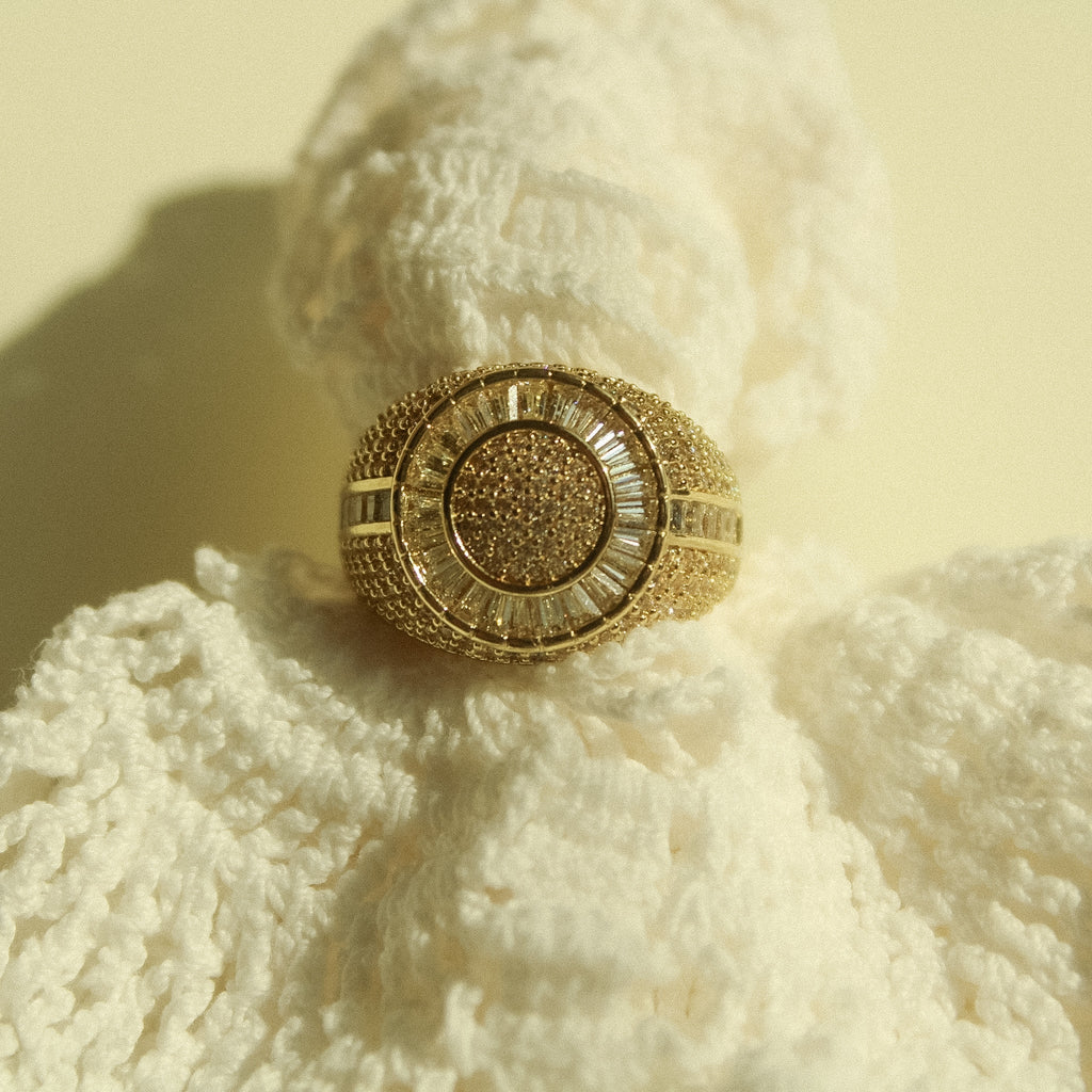 Gold-tone signet ring with round pavé CZ center and halo around the face