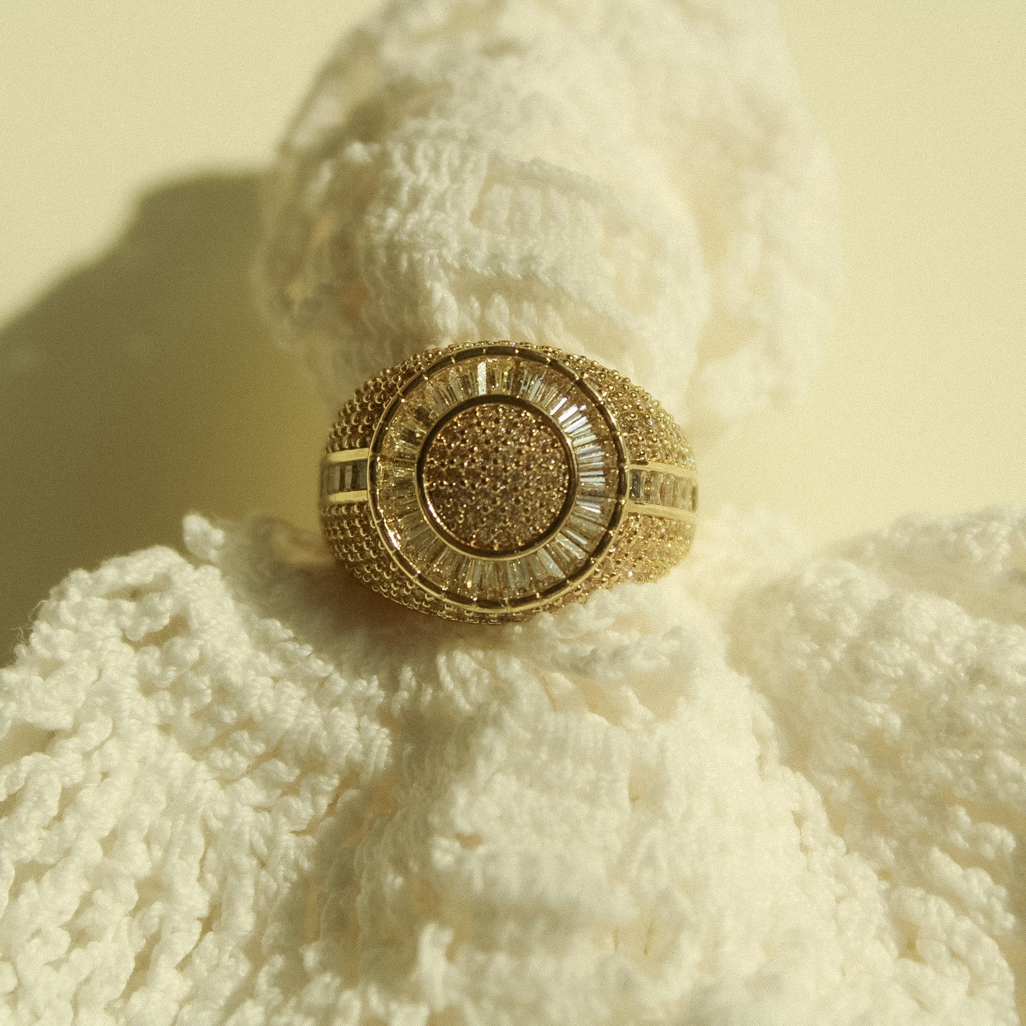 Gold-tone signet ring with round pavé CZ center and halo around the face
