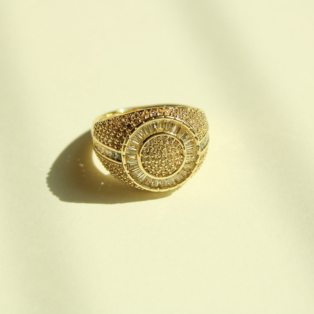 Gold-tone signet ring with wide pavé CZ top and round center cluster