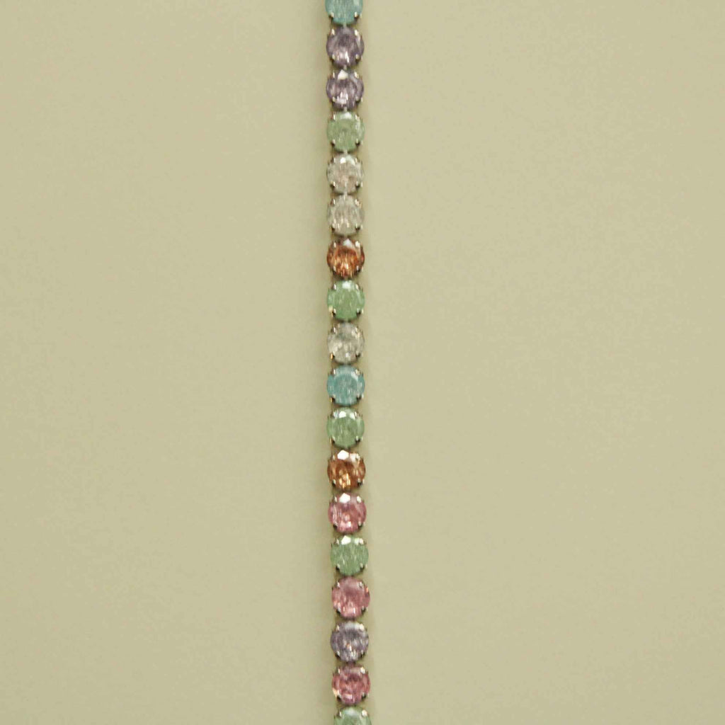 Multicolor CZ tennis bracelet featuring rows of pastel stones on silver-toned chain