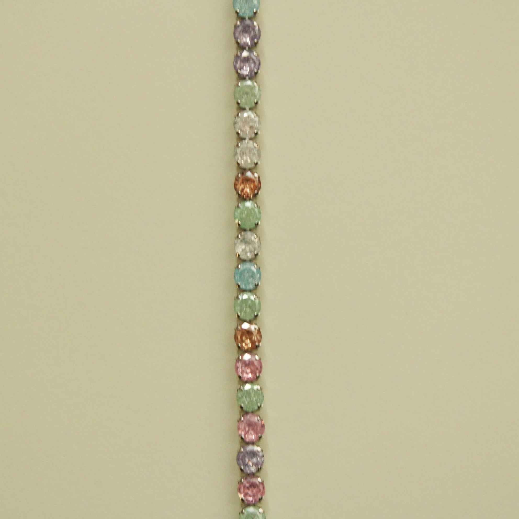 Multicolor CZ tennis bracelet featuring rows of pastel stones on silver-toned chain