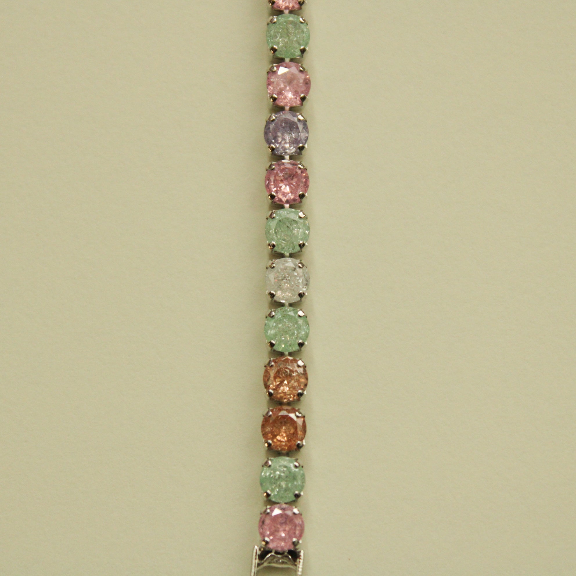 Multicolor CZ tennis bracelet with oval-cut pastel stones and silver-toned links