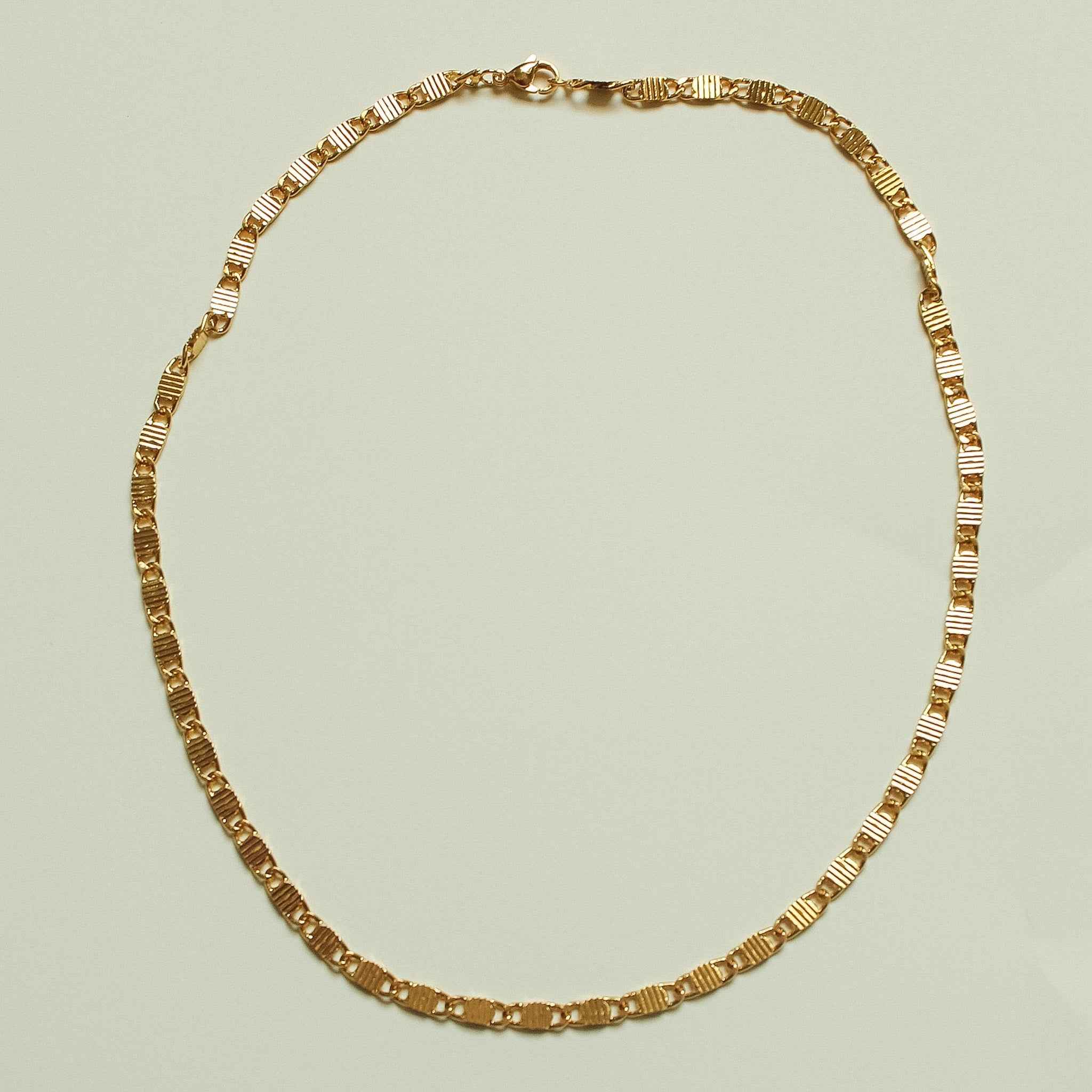 Gold-tone textured link chain necklace, full loop with striped links