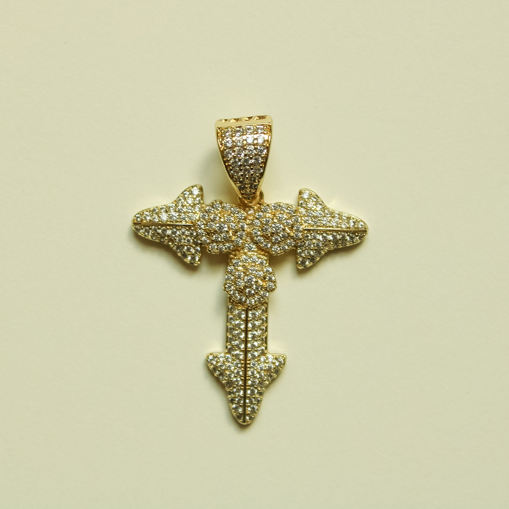 Gold-tone cross pendant with pavé stones and rose detail