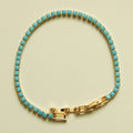 Turquoise beaded tennis bracelet with gold bar clasp and turquoise oval stones