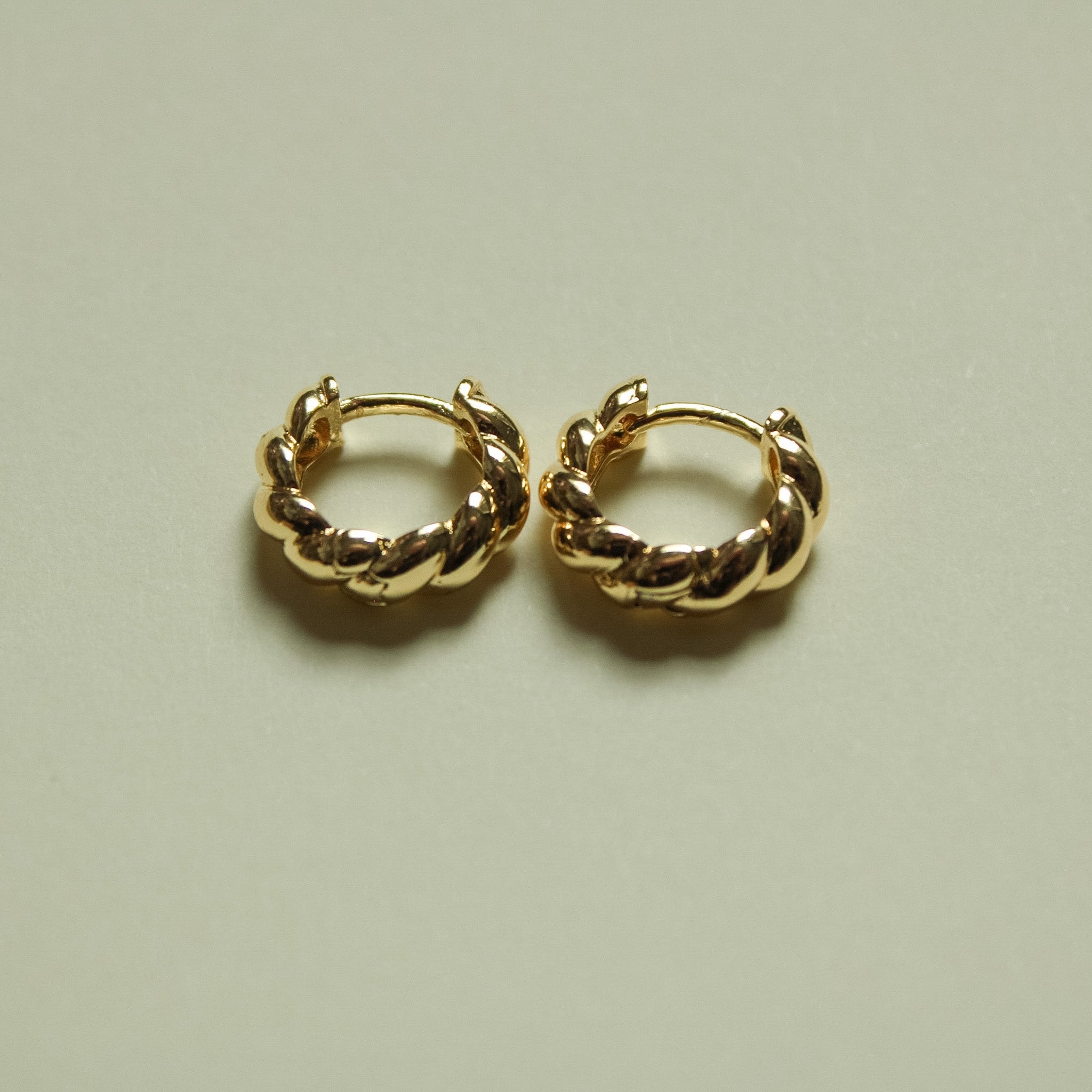 Twisted huggie hoop earrings, gold-tone twisted hoops with clasped ends