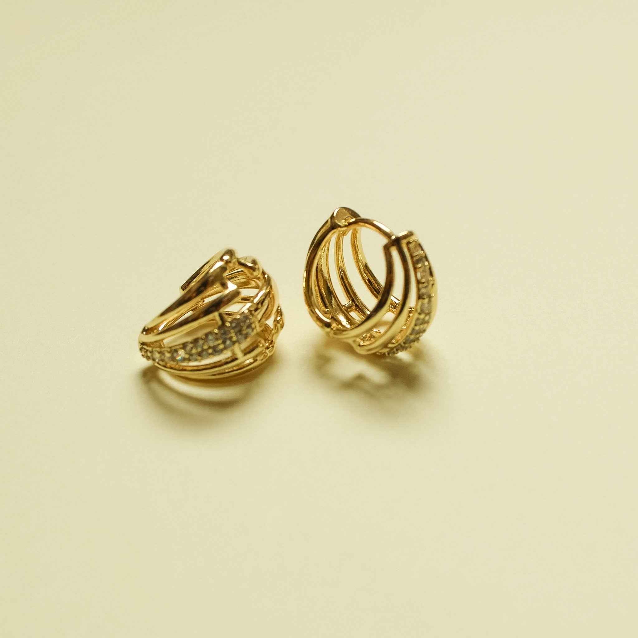 Wide pavé CZ huggie hoop earrings in 14K gold